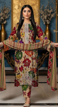 Woman wearing a colorful traditional outfit with a patterned scarf in an elegant setting.
