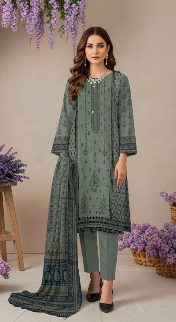 Woman wearing a green embroidered outfit with close-up details and product information.