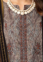 Woman wearing a traditional outfit with embroidered details, set against a neutral background.