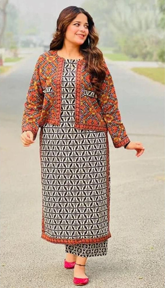 Woman wearing a printed outfit with 'Sapphire' branding on a product label.