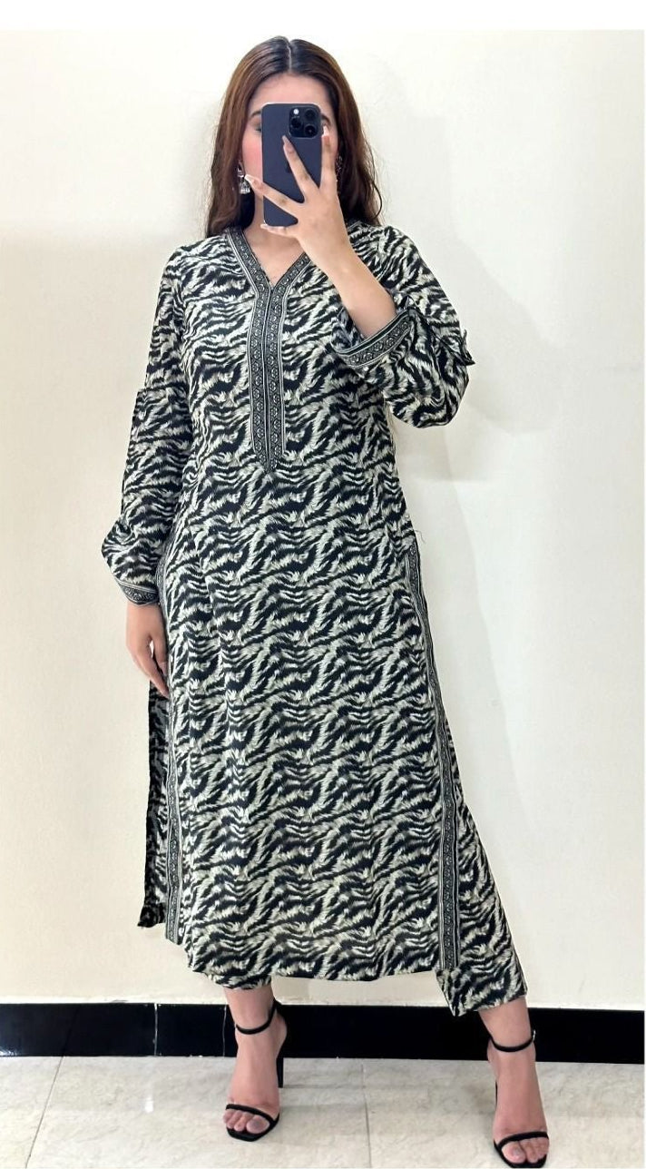 Woman wearing a patterned shirt and dupatta with 'Sapphire' branding on a white background.