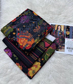Colorful fabric with intricate patterns on a white surface, accompanied by a product card.
